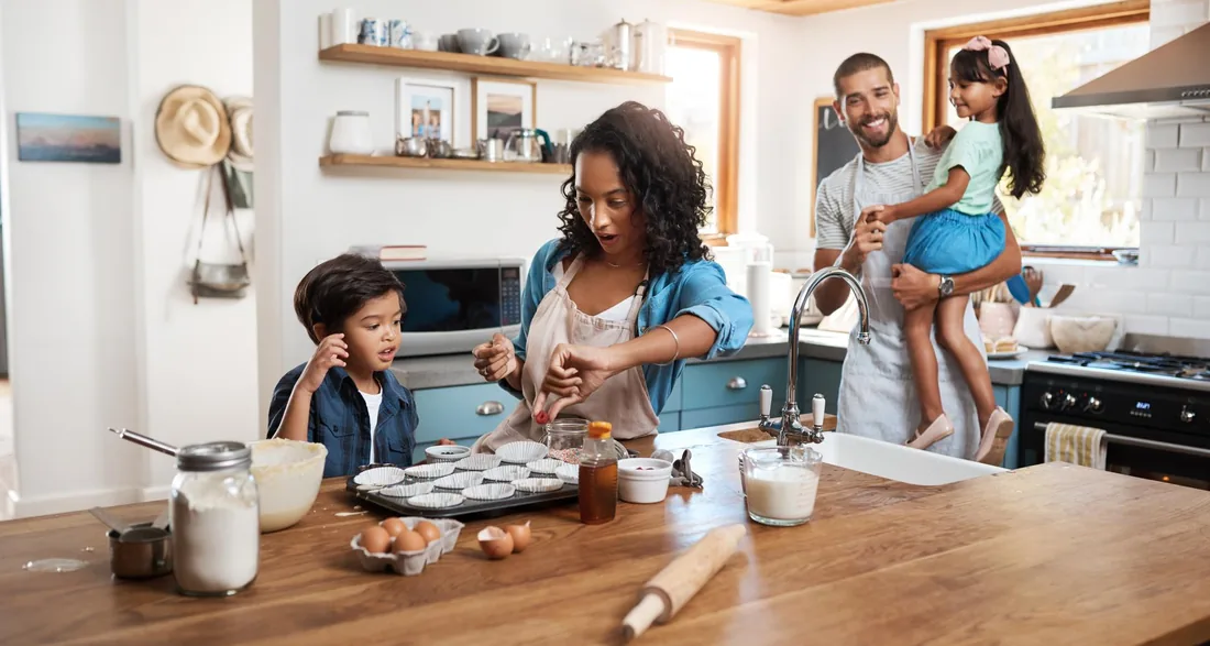 Couple preparing vegetables together on a kitchen island
